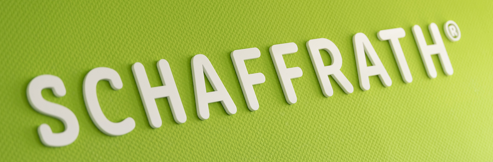 Schaffrath-Logo auf einer grünen Wand